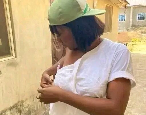 A woman in torn clothes.